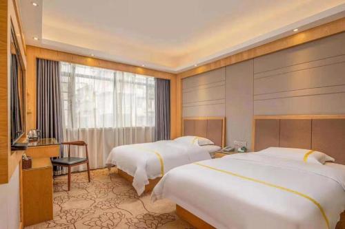 Ένα ή περισσότερα κρεβάτια σε δωμάτιο στο Mao Hua hotel