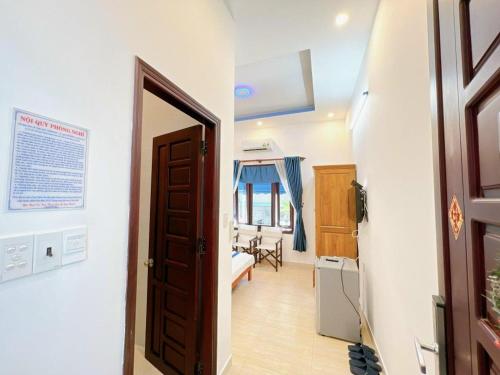 a room with a door leading to a bedroom at Villa Sapphire in Vung Tau