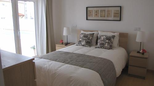 a bedroom with a large bed with two pillows at Casa De Soudos in Soudos