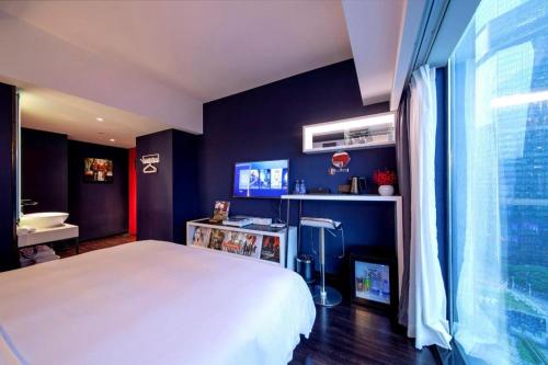 Letto o letti in una camera di M Hotel Shenzhen Nanshan