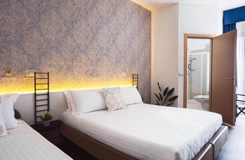 Postel nebo postele na pokoji v ubytování Hotel Acropolis