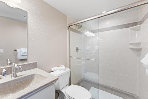 a bathroom with a toilet and a glass shower at Rockridge 41 by Summit County Mountain Retreats in Breckenridge