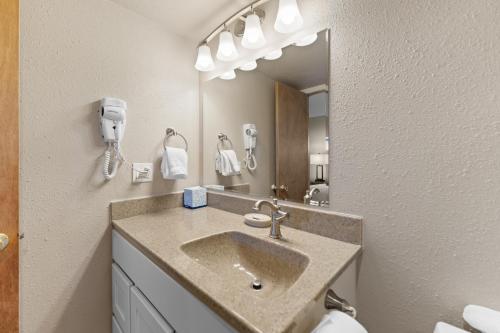 a bathroom with a sink and a mirror at Rockridge 41 by Summit County Mountain Retreats in Breckenridge