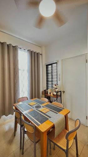 a dining room with a table and chairs at Casa Esperanza 1376 in Dauis