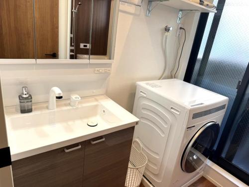 Et badeværelse på ByLug Stay 中津