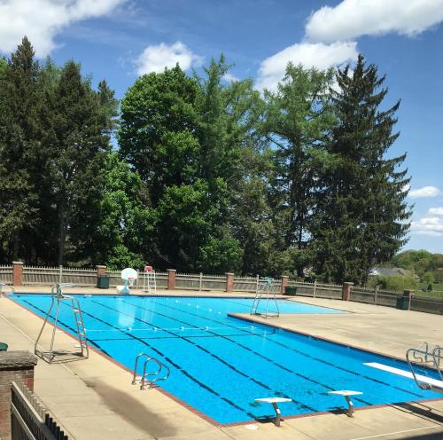 a large swimming pool with blue water at The Bertram Inn at Glenmoor in Canton