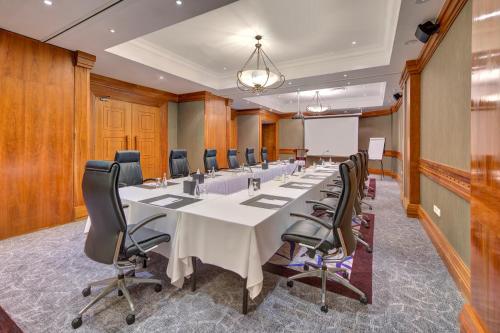 a large conference room with a long table and chairs at Hilton Salalah Resort in Salalah