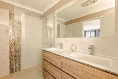 a bathroom with a sink and a mirror at Spindrift Escape in Dunsborough