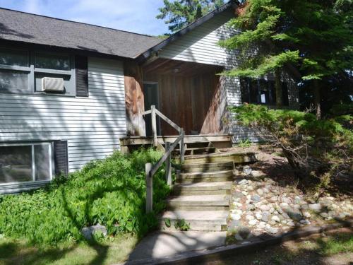 a house with stairs leading up to a house at Birchwood Inn in Harbor Springs