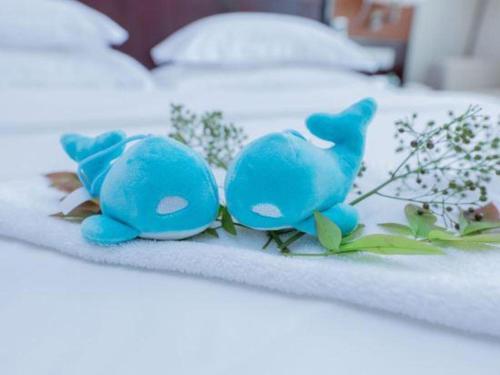 Una cama o camas en una habitación de Excemon Yuyao Hemudu Hotel
