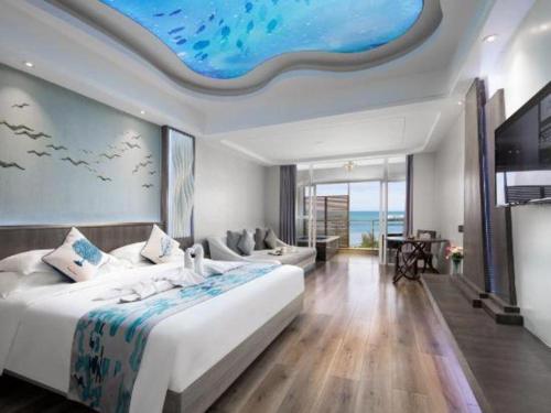 a bedroom with a large bed with a dolphin ceiling at HuangMa holiday yacht view sea resort hotel in Haikou