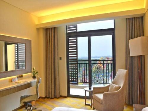 a hotel room with a view of a balcony at Wuhan Gleetour Hotel in Wuhan