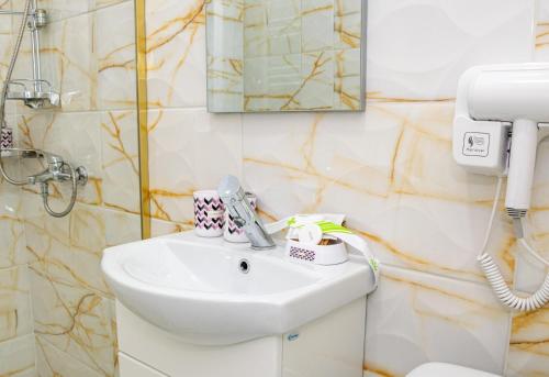 Koupelna v ubytování RUXO Hotel