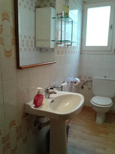 a bathroom with a sink and a toilet at Can Mestre in Cambrils
