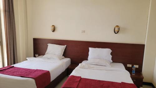Ένα ή περισσότερα κρεβάτια σε δωμάτιο στο Yiganda Hotel, Bahir Dar