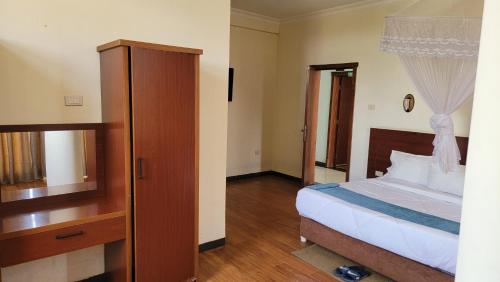 Ένα ή περισσότερα κρεβάτια σε δωμάτιο στο Yiganda Hotel, Bahir Dar