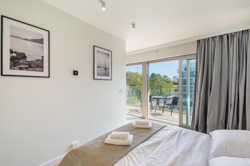 Ένα ή περισσότερα κρεβάτια σε δωμάτιο στο NORTH Apartments, View Mare Solaris