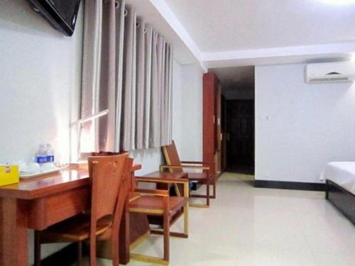 Ένα ή περισσότερα κρεβάτια σε δωμάτιο στο An Dong Center Hotel Chinatown Saigon