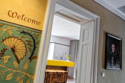 a doorway into a room with a painting on the wall at Niedermairhof in Brunico