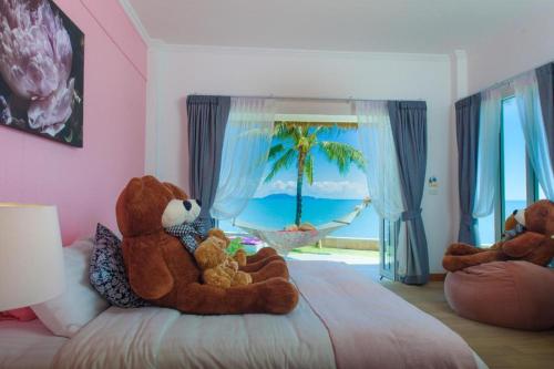 Postel nebo postele na pokoji v ubytování Sea Coco Resort
