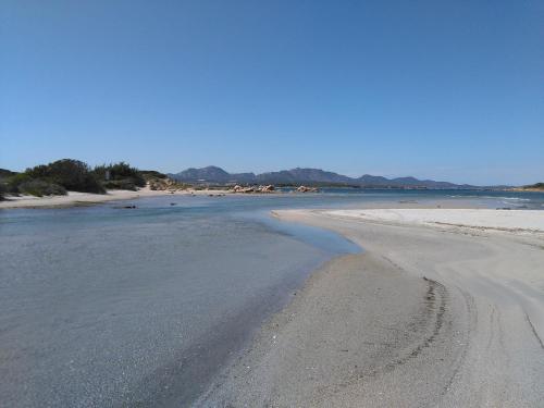 an empty beach with footprints in the sand at Casa Marina Maria in Murta Maria