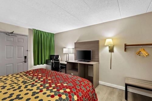 Ένα ή περισσότερα κρεβάτια σε δωμάτιο στο Econo Lodge