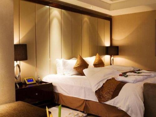 Ένα ή περισσότερα κρεβάτια σε δωμάτιο στο Xian Yohol Hotel