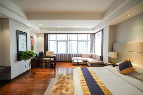 Ένα ή περισσότερα κρεβάτια σε δωμάτιο στο Xian Yohol Hotel