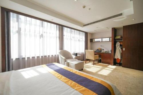 Ένα ή περισσότερα κρεβάτια σε δωμάτιο στο Xian Yohol Hotel