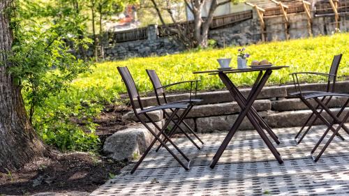 a table and chairs sitting on a patio at Niedermairhof in Brunico