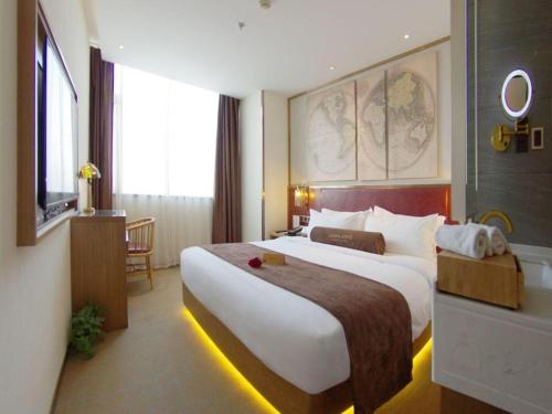 a hotel room with a large bed and a tub at James Joyce Coffetel Beijing Yizhuang Rongjing East Street Subway Station in Beijing