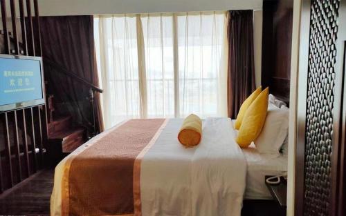 Postel nebo postele na pokoji v ubytování Man Wan Harmona Resort