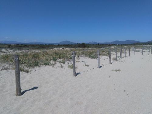 a fence in the sand in the desert at Casa Marina Maria in Murta Maria