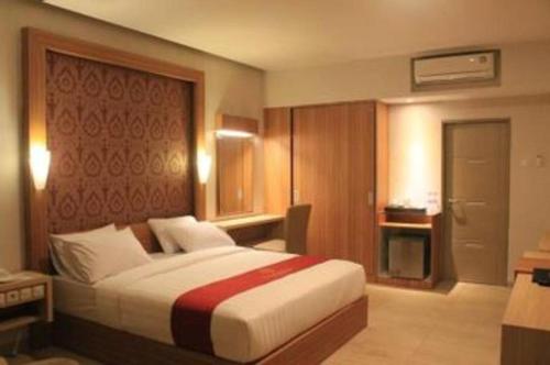 Postel nebo postele na pokoji v ubytování Grand Dian Hotel Slawi