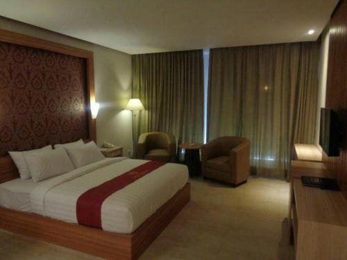 Postel nebo postele na pokoji v ubytování Grand Dian Hotel Slawi