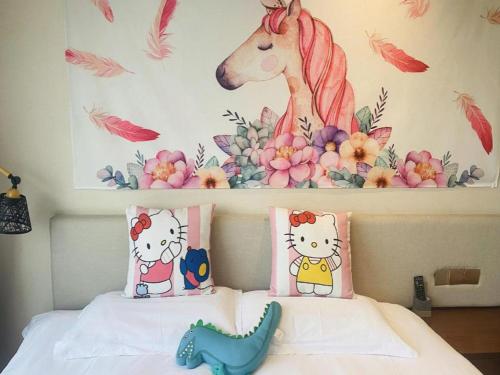a bedroom with a bed with a horse on the wall at Hangzhou Berman Hotel in Hangzhou
