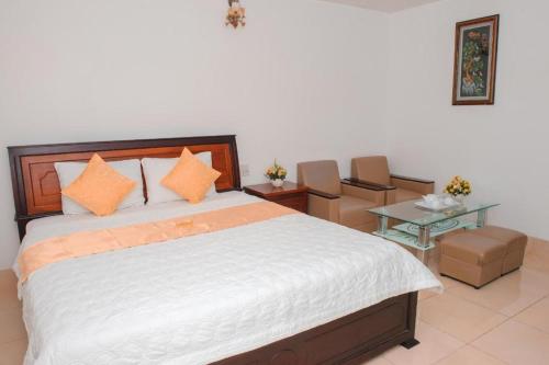 Кровать или кровати в номере Ngoc Giau Hotel