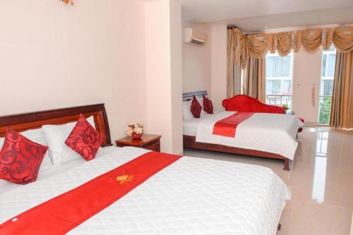Кровать или кровати в номере Ngoc Giau Hotel