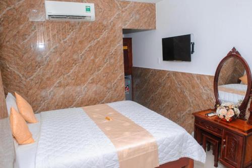 Кровать или кровати в номере Ngoc Giau Hotel