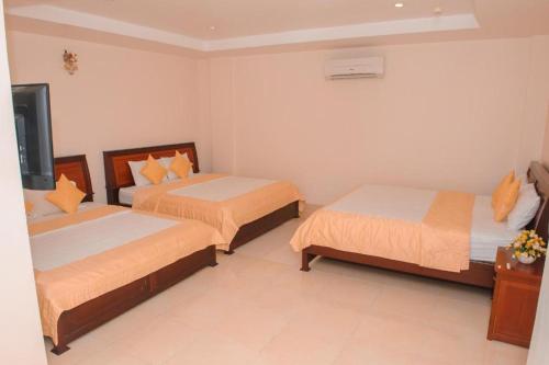 Кровать или кровати в номере Ngoc Giau Hotel