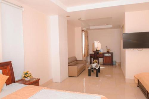 Телевизор и/или развлекательный центр в Ngoc Giau Hotel