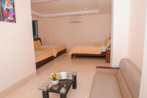 Кровать или кровати в номере Ngoc Giau Hotel