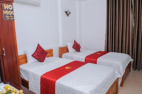 Кровать или кровати в номере Ngoc Giau Hotel