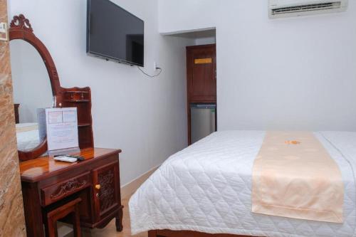 Кровать или кровати в номере Ngoc Giau Hotel