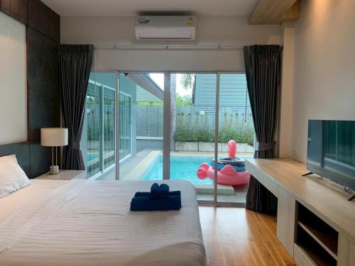 Postel nebo postele na pokoji v ubytování I am pool villa Pattaya no 5