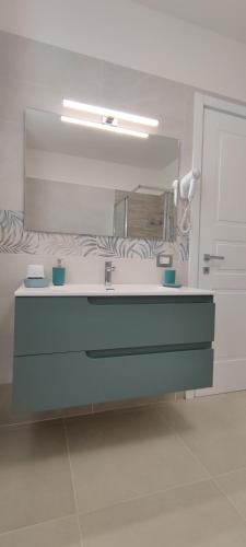 a bathroom with a sink and a mirror at B&B Terra Camerte in Camerino