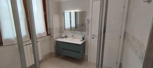 a bathroom with a sink and a mirror at B&B Terra Camerte in Camerino