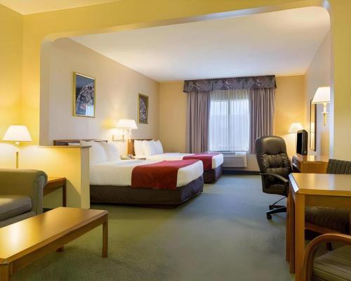 En eller flere senge i et værelse på Comfort Suites La Porte - Baytown