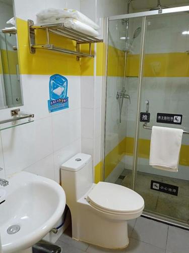 a bathroom with a shower and a toilet and a sink at 7 Days Inn Hohhot Hailiang Xinhua Square Metro Station in Hohhot