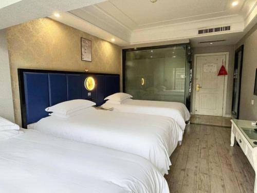 Letto o letti in una camera di mingjia hotel